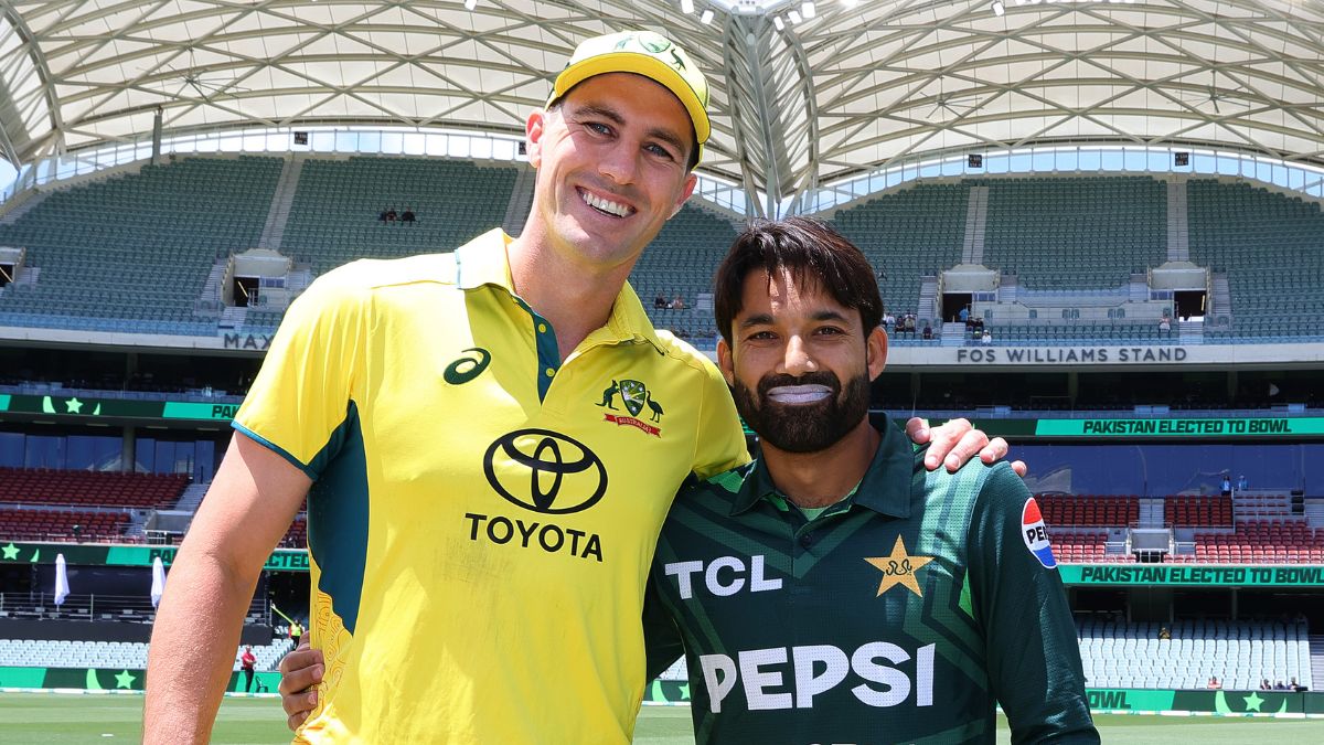 Pat Cummins with Mohammad Rizwan