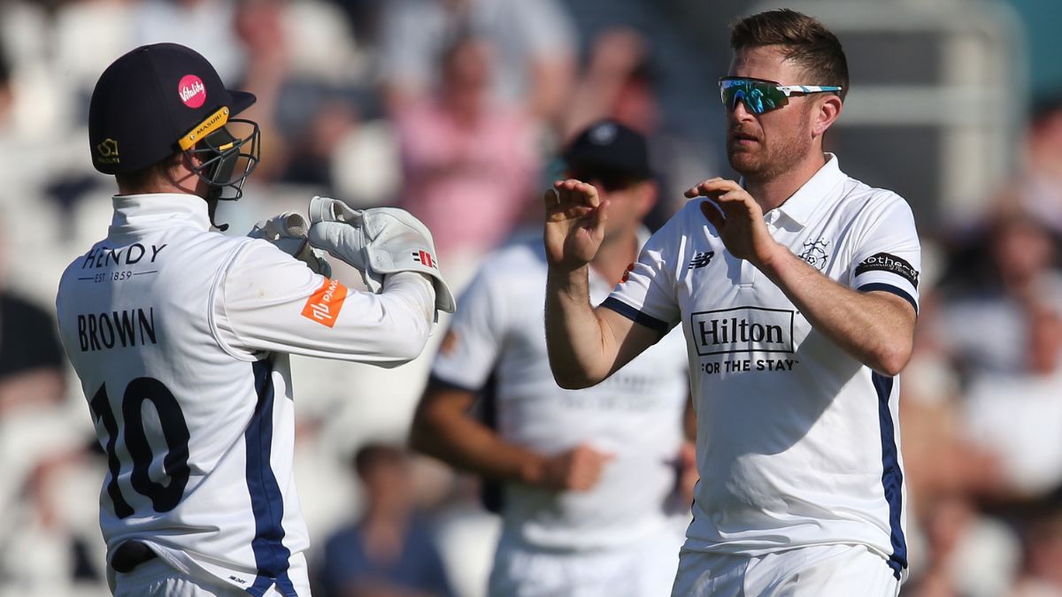 Liam Dawson celebrates a wicket with Ben Brown
