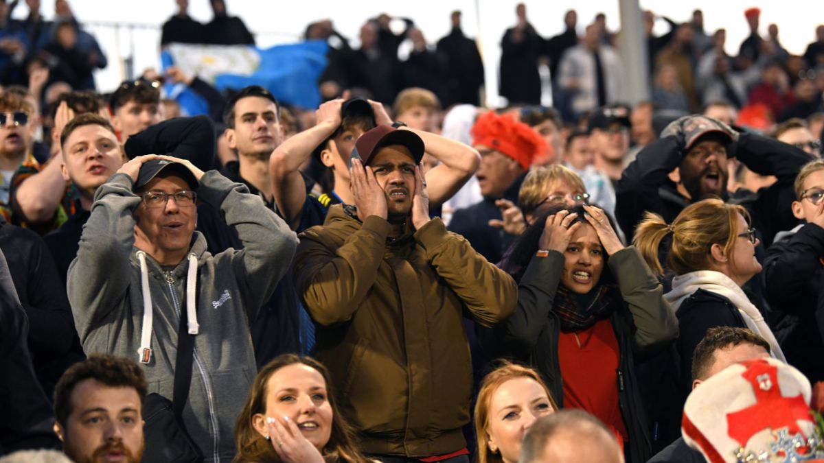 Shocked cricket fans