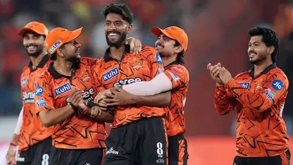Praful Hinge celebrates a wicket with his SRH teammates