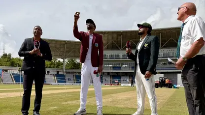 Roston Chase and Babar Azam at the toss