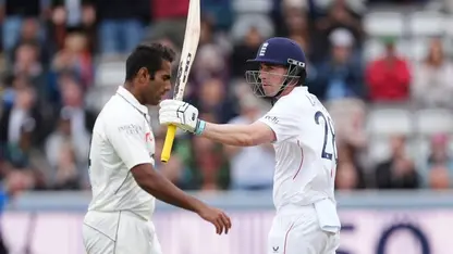 Dan Lawrence celebrates his fifty on a rain-ravaged day at Lord's