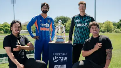 Shreyas Iyer and Mitchell Santner pose with the T20I trophy